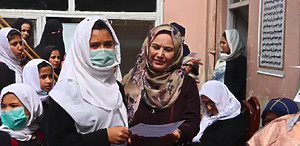 2 Afghan women receiving from support from Canadian Women for Women in Afghanistan