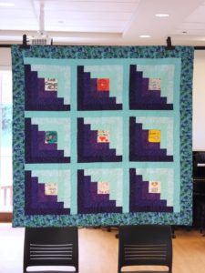 A hanging quilt from The Love Quilt Project